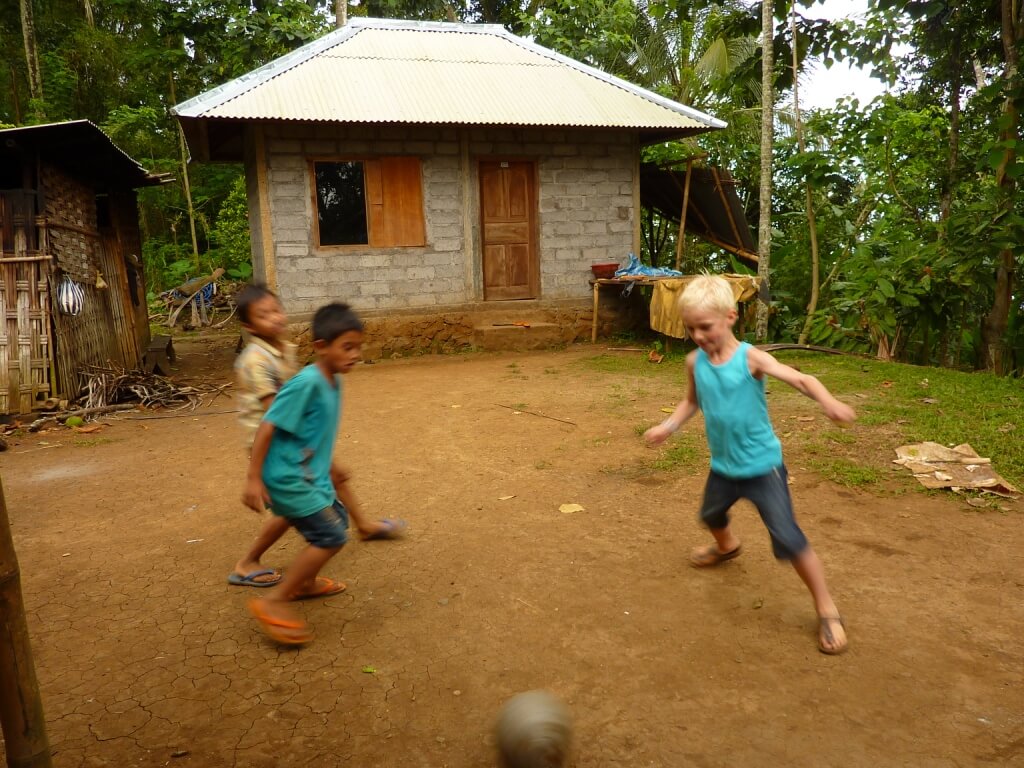 Playing soccer with local kids